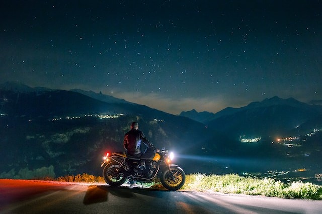 man with motorcycle at night